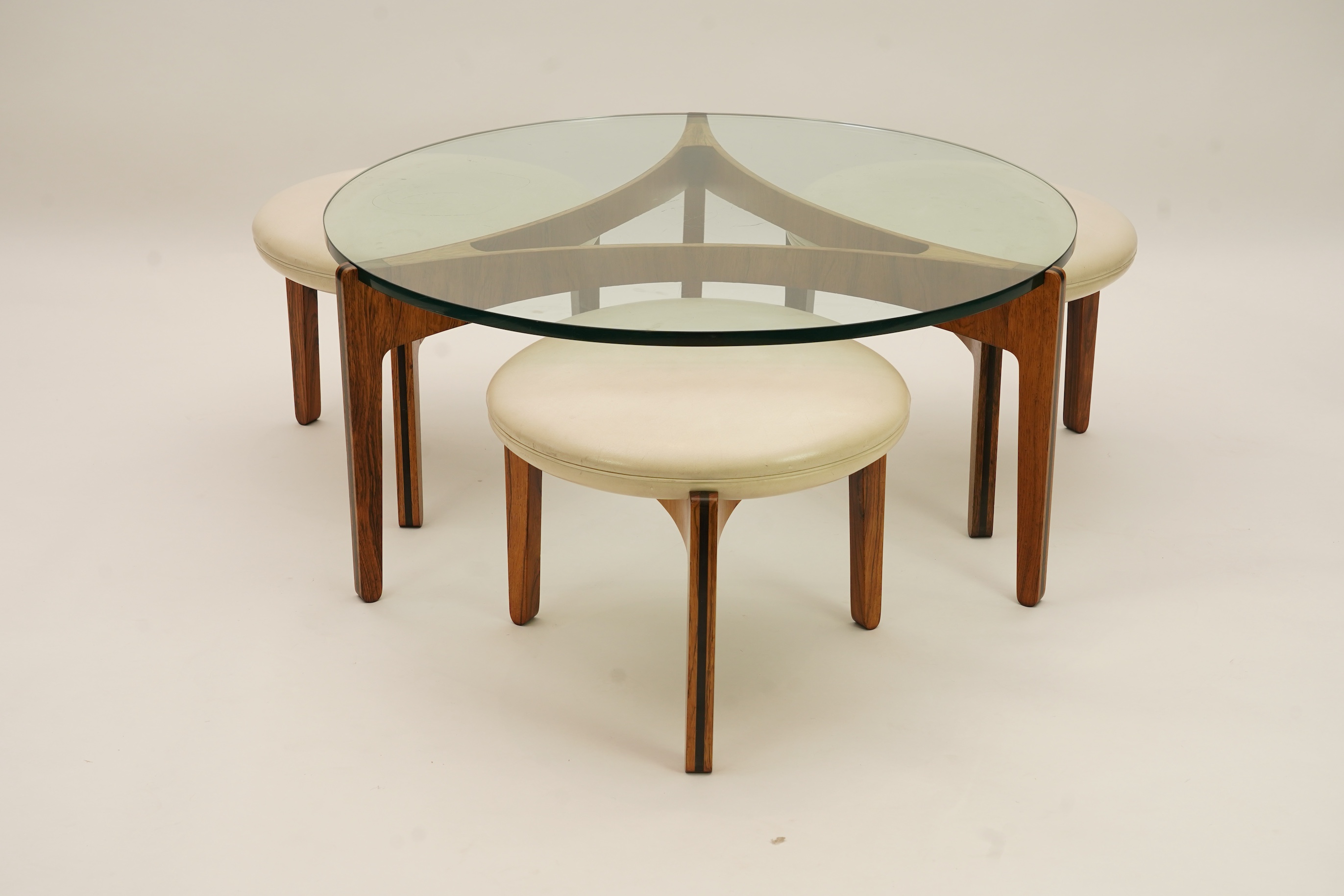 Sven Ellekaer (Danish, 1926-1984) for Christian Linneberg Møbelfabrik: A coffee table and three nesting stools ensuite